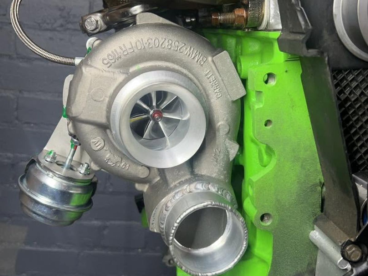 Green painted block with turbo fitted on the stand