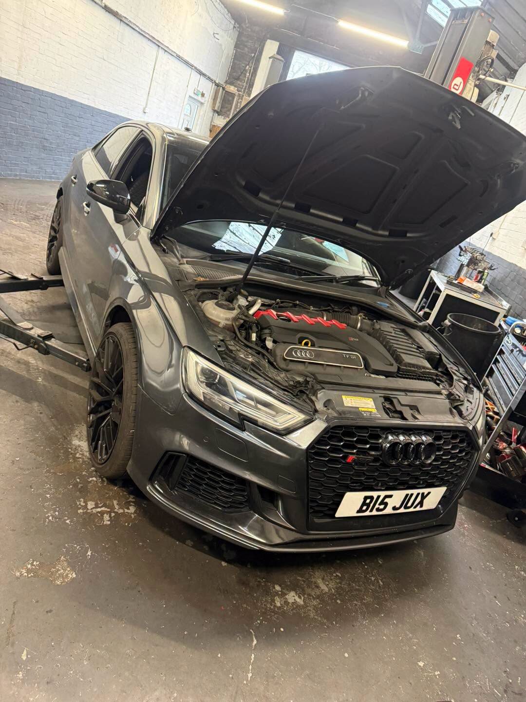 Audi RS3 in the workshop, bonnet up